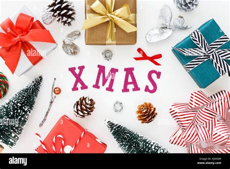 Christmas decoration with xmas word on white background flat lay Stock Photo - Alamy