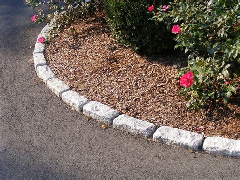 Driveway edging: Standard cobblestones used as walkway and planter bed edging. | Driveway edging ...