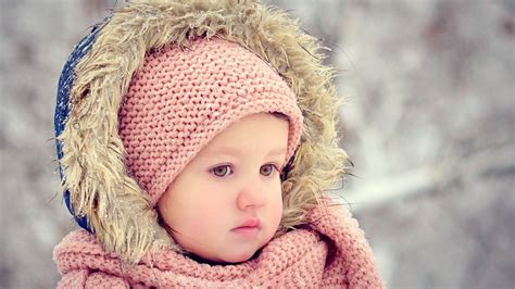 Cute Baby Girl In Blur Background Wearing Woolen Netted Dress And ...