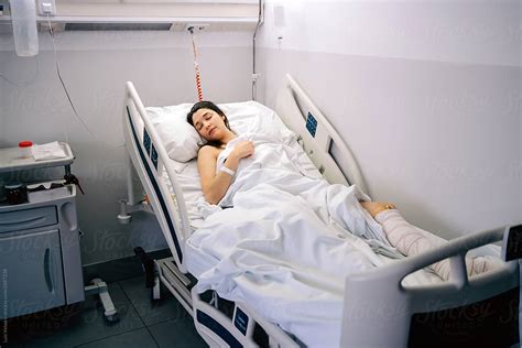 "Female Patient Sleeping In A Hospital." by Stocksy Contributor "Luis Velasco" - Stocksy