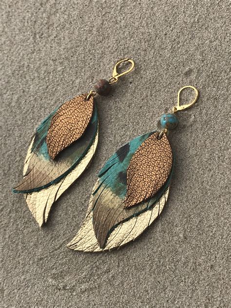 Excited to share this item from my #etsy shop: Leather earrings, leather feather earrings, teal ...