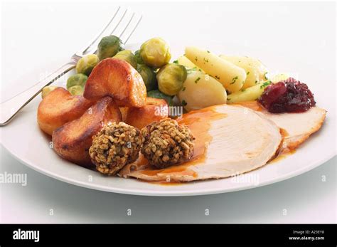 Plate of Christmas dinner with turkey, stuffing, roast potatoes ...