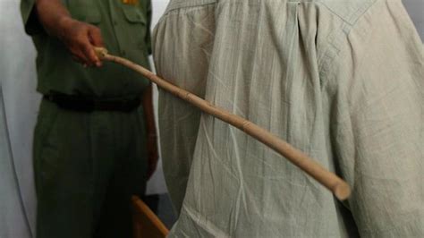 Abuja Man Gets 6 Strokes of the Cane for Misbehaving! | BellaNaija