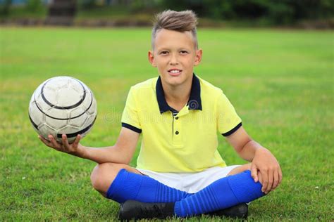 Boy Soccer Player Sitting on the Soccer Field Stock Image - Image of ...