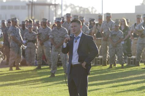 Marine Cpl. William “Kyle” Carpenter, recent Medal of Honor recipient, addresses a crowd aboard ...