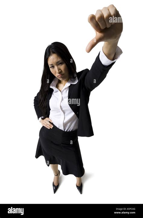 Businesswoman giving thumbs down signal Stock Photo - Alamy