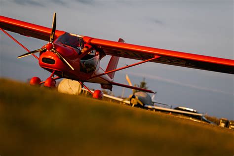 Download Amazing Red Bi-plane Model Soaring In The Sky Wallpaper ...