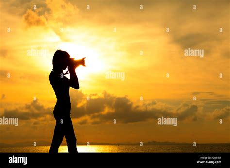 Silhouette photographer at sunset Stock Photo - Alamy