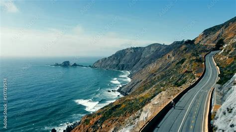 Aerial view Incredible scenery of the Atlantic Ocean coastline and rocky shore. Road by the ...