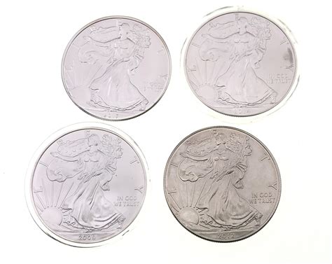 Lot - LOT OF 4 ASSORTED AMERICAN SILVER EAGLE COINS