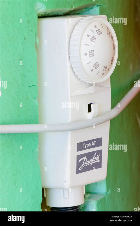 Danfoss AT hot water cylinder thermostat on a central heating hot Stock Photo: 62232419 - Alamy