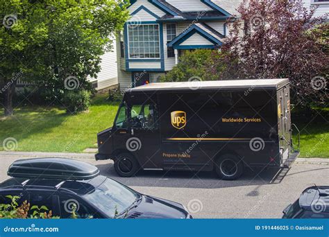 UPS Delivery Truck Parked by the Side of the Road in Front of ...