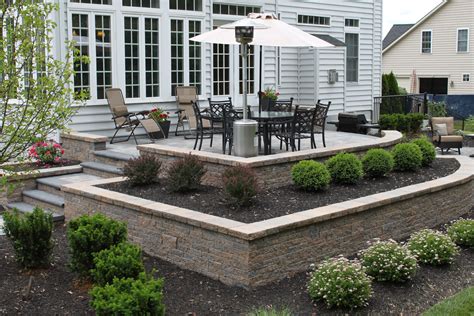 Raised patio using planter boxes and retaining wall, by R&R Caddick ...