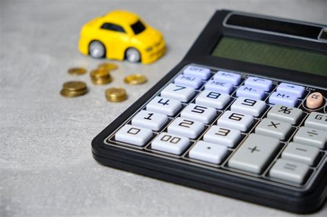 Premium Photo | Calculator coins and car concept buying car