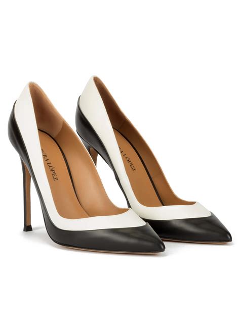 Two-tone high heel pumps in black and white leather . PURA LOPEZ