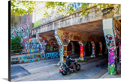 A motorcyclist enters the graffiti-covered Krog Street Tunnel in Atlanta, Georgia Wall Art ...