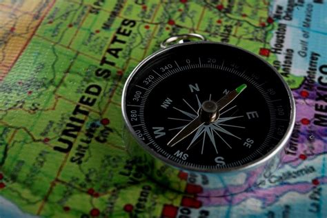 Compass with a map background 1953139 Stock Photo at Vecteezy