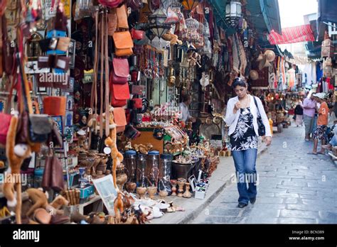 Residents browse the shops of the Tunis Medina in Tunisia. The Medina ...