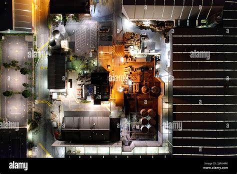 An aerial view of industrial zone surrounded by buildings in night Stock Photo - Alamy