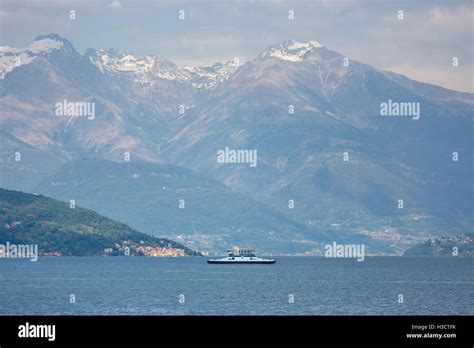 Ferry at Lake Como on the background of mountains Stock Photo - Alamy