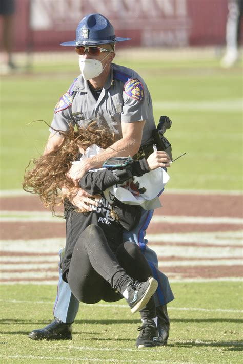 Mississippi State fans ring cowbells as protestors tackled, dragged off ...