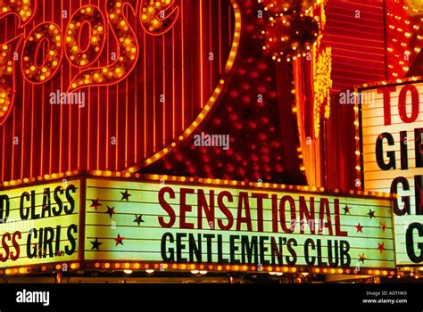 Las Vegas Freemont Street at night. Colorful bright neon lights. Gentlemen's Club and casino ...