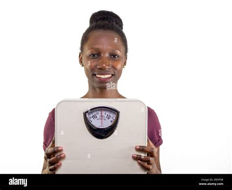 Young woman showing a weight scale isolated on white background Stock Photo - Alamy