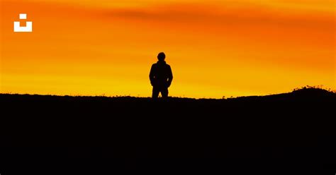 Man standing at peak at golden hour photo – Free Sunset Image on Unsplash