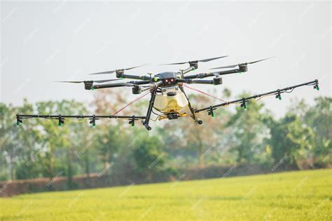 Premium Photo | Agriculture drone flying over the rice field to sprayed ...