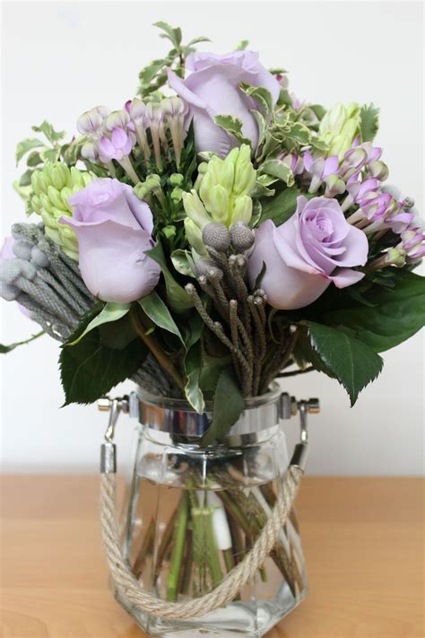 Lilac, and pale green Mother's Day floral arrangement, arranged in a ...