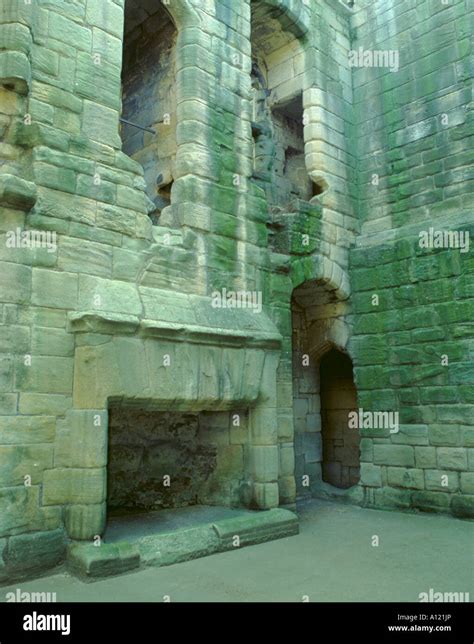 Sandstone fireplace and walls; interior of Warkworth Castle, Northumberland, England, UK Stock ...