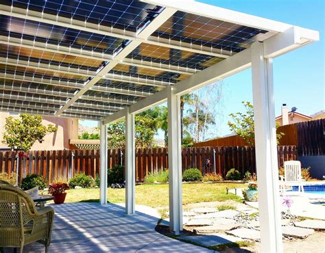 a patio covered in solar panels next to a swimming pool