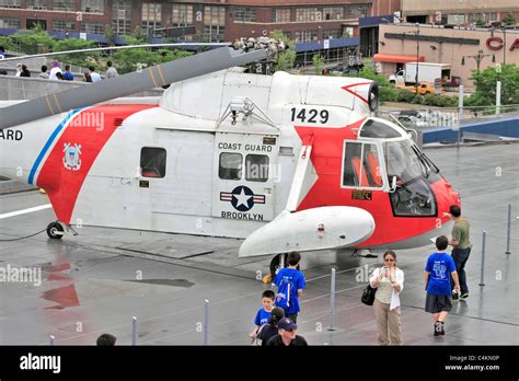 United States Coast Guard rescue helicopter on flight deck of the USS ...