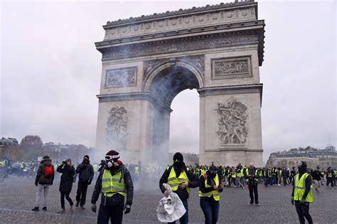 In photos: At least 65 injured in Paris protests over Macron policies