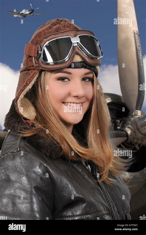 Woman pilot wearing vintage pilot helmet flight jacket and goggles Stock Photo - Alamy