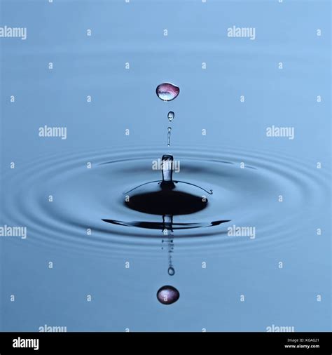 Colored water drop splash Stock Photo - Alamy