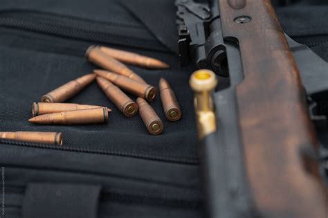 "SKS Rifle With Loose Ammunition In Focus" by Stocksy Contributor "Matt ...