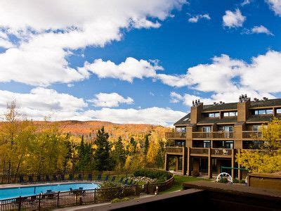 The outdoor heated pool at Caribou Highlands Lodge showcases Lutsen Mountains changing colors ...