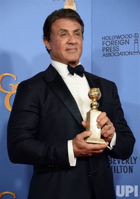 Photo: Sylvester Stallone wins an award at the 73rd annual Golden Globe ...