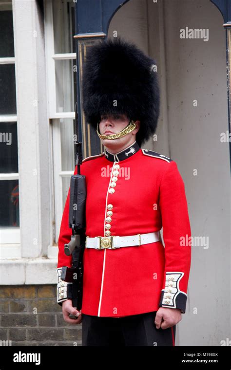 England London. Circa July 2014. Royal guard in red uniform standing on duty at Buckingham ...