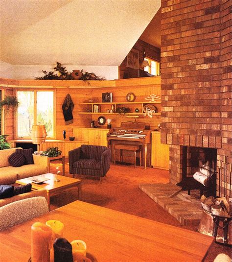 a living room filled with furniture and a fire place next to a brick ...