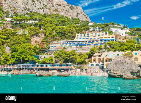 view of Marina Piccola beach from sea with mountain, hotels and restaurants behind it on sunny ...