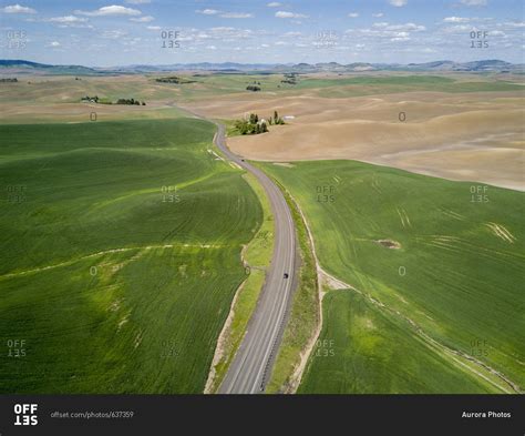 Beautiful aerial view of scenery with rolling hills and road, Pullman, Palouse, Washington State ...