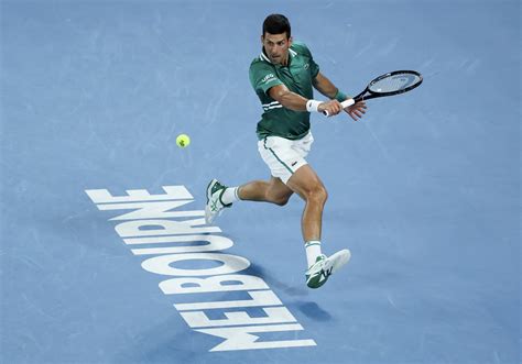 Novak Djokovic goes into Australian Open semis after tense battle ...