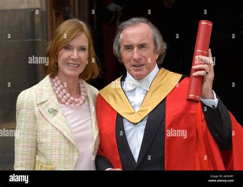 Former F1 racing driver Sir Jackie Stewart, with his wife, receiving an ...