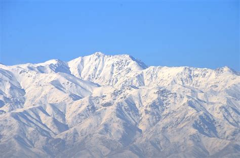 Snowy mountains surround Bagram | After several days on rain… | Flickr