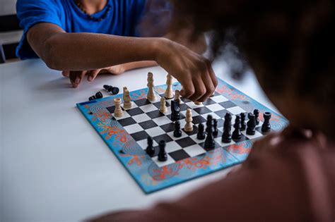 Hands In Action Two Black Kids Play Chess At Home Stock Photo - Download Image Now - iStock