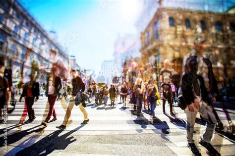 Crowd of anonymous people walking on busy city street Stock Photo ...