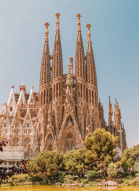 the large cathedral has many spires on it's sides and is surrounded by ...