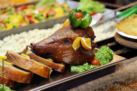 Head of a crispy roasted suckling pig also known as pork lechon Stock Photo | Adobe Stock